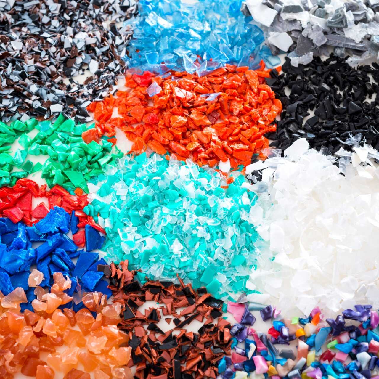 Different regrind polymers after milled in a shredder for recycling process